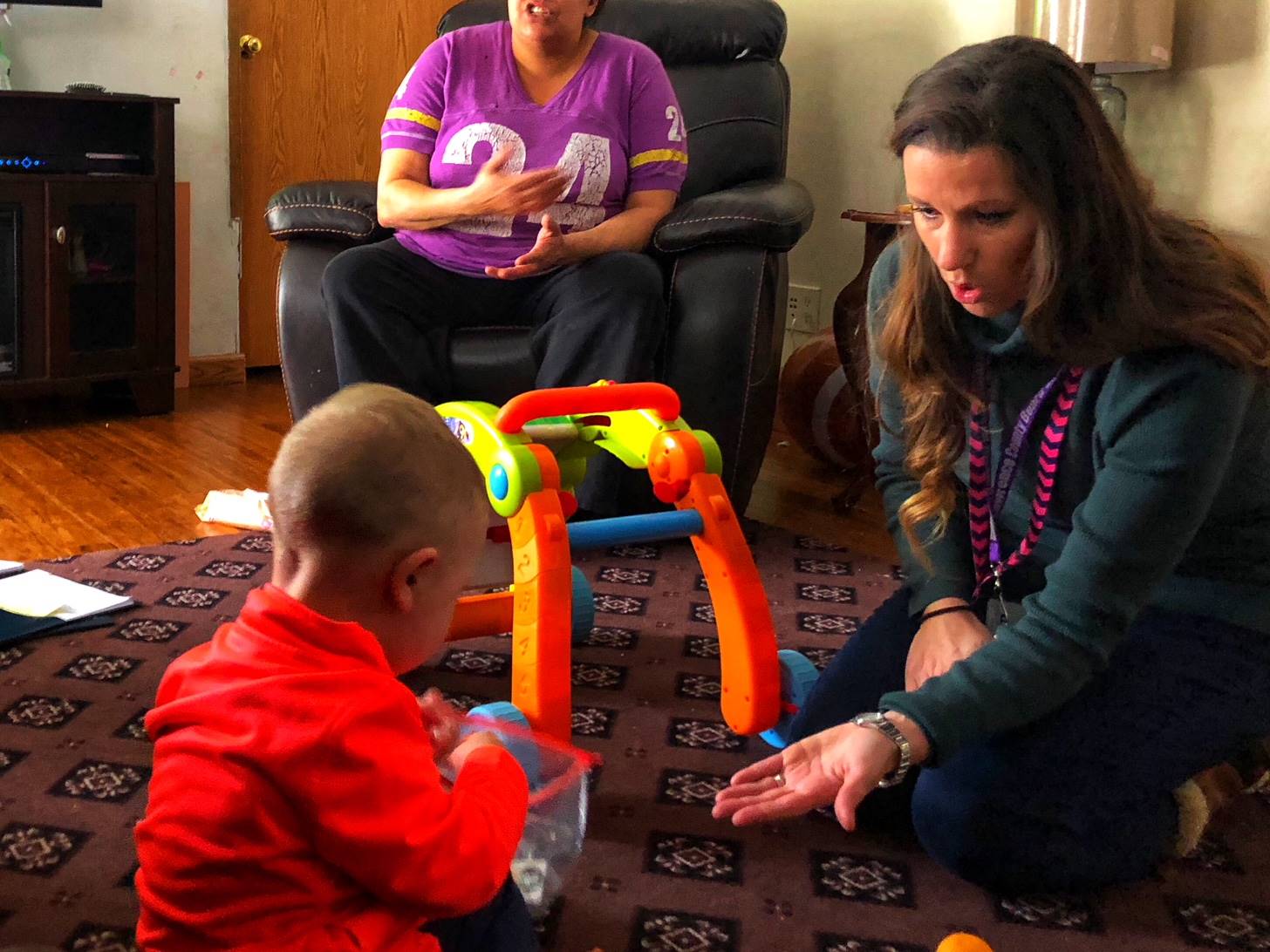 Developmental specialist meets with family