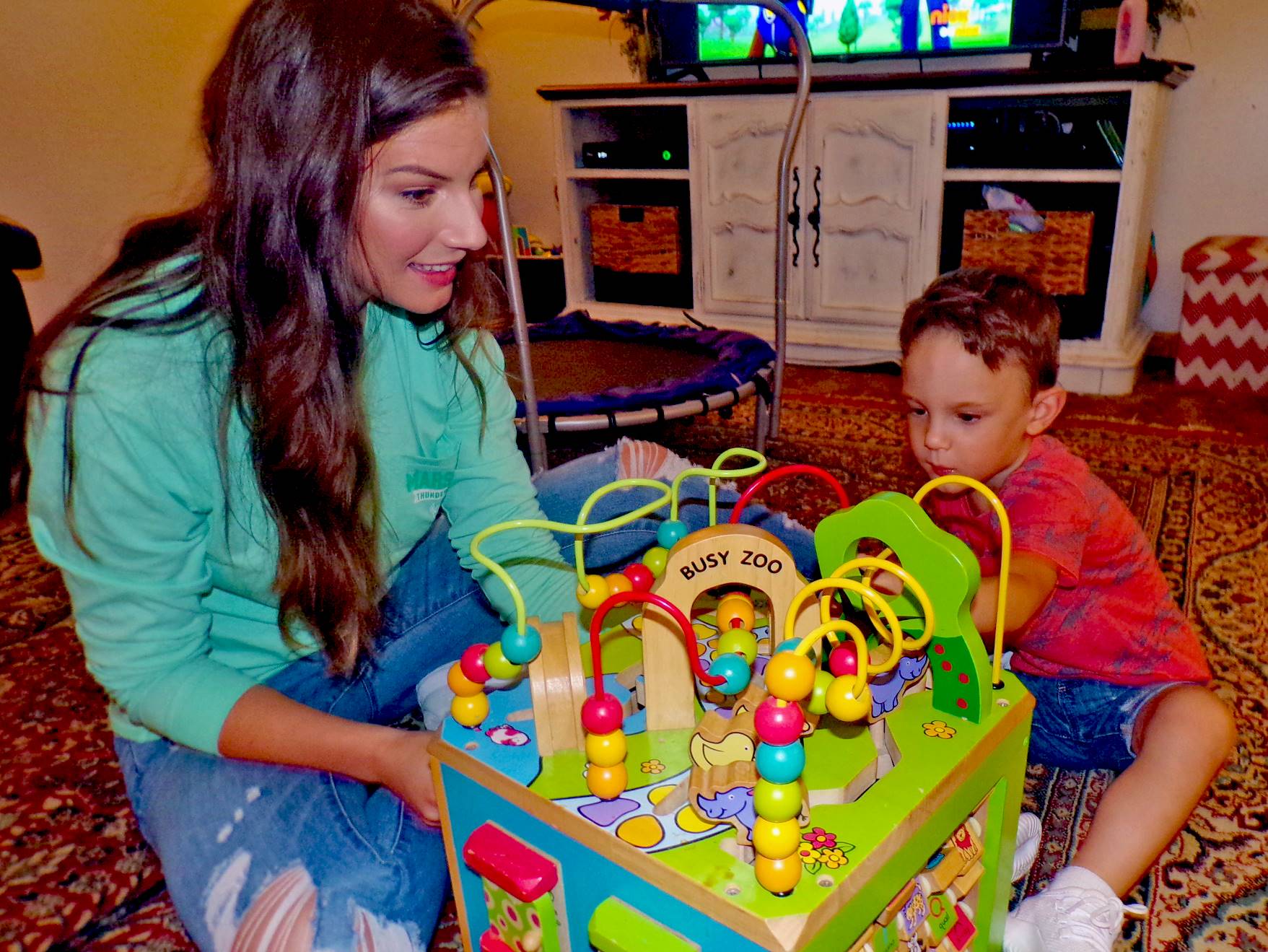 Mother works with child in home setting